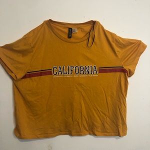 A mustard yellow top( has a lil crop to it)